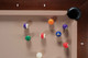Overhead view of Zoey slate pool table corner pocket with genuine leather drop and mother-of-pearl diamond sight set into maple rail. Overhead view of Zoey slate pool table corner pocket with genuine leather drop and mother-of-pearl diamond sight set into maple rail.